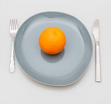 a few oranges on a plate