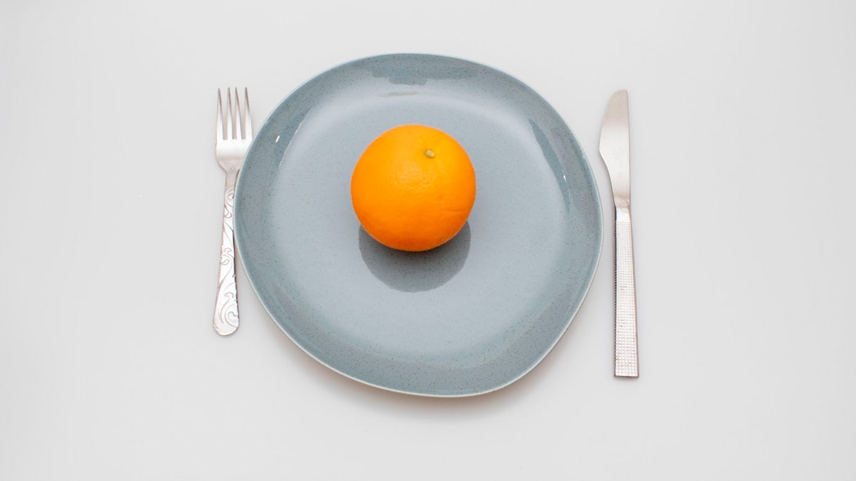a few oranges on a plate